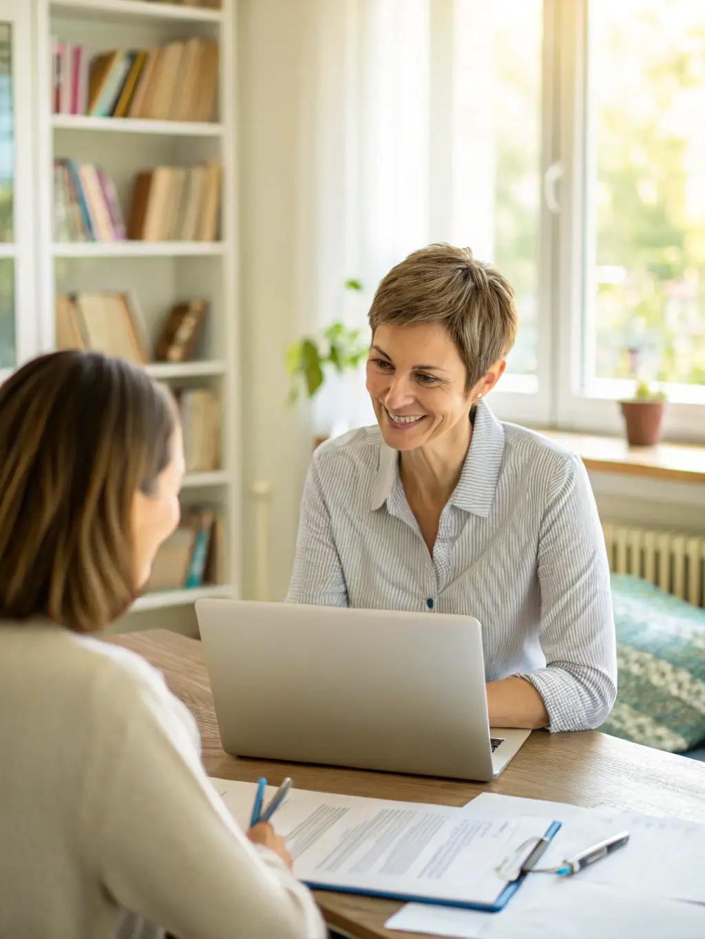 A photograph of a counselor in a bright, welcoming office, engaged in a supportive conversation with a client, representing counseling services.